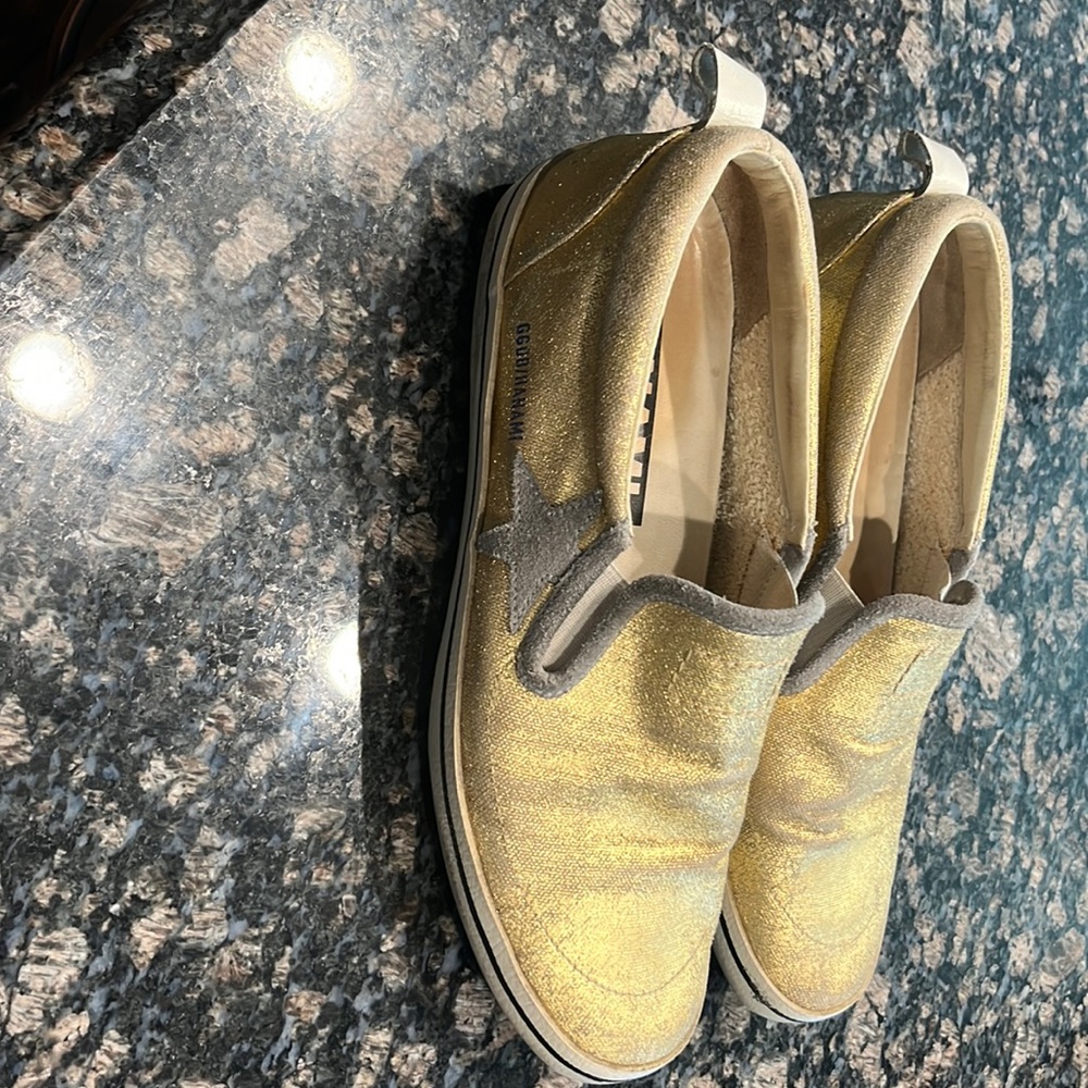 Golden Goose slides in metallic gold with grey accents